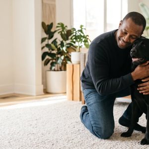 Man hugging his Labrador